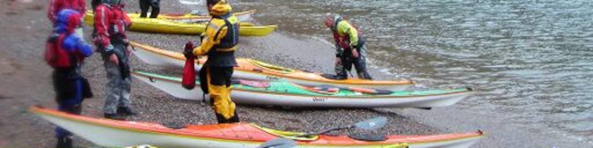 Beach below the Cupps, Ronas Voe Rain and very strong winds made this an interesting trip in the shelter of the cliffs in Ronas Voe. After crossing from the NE side to this beach on the SW side with a crosswind and some rough water, we took a well-deserved lunch break on this beach with red granite shingle from the eroded cliffs which were providing limited shelter from the weather.