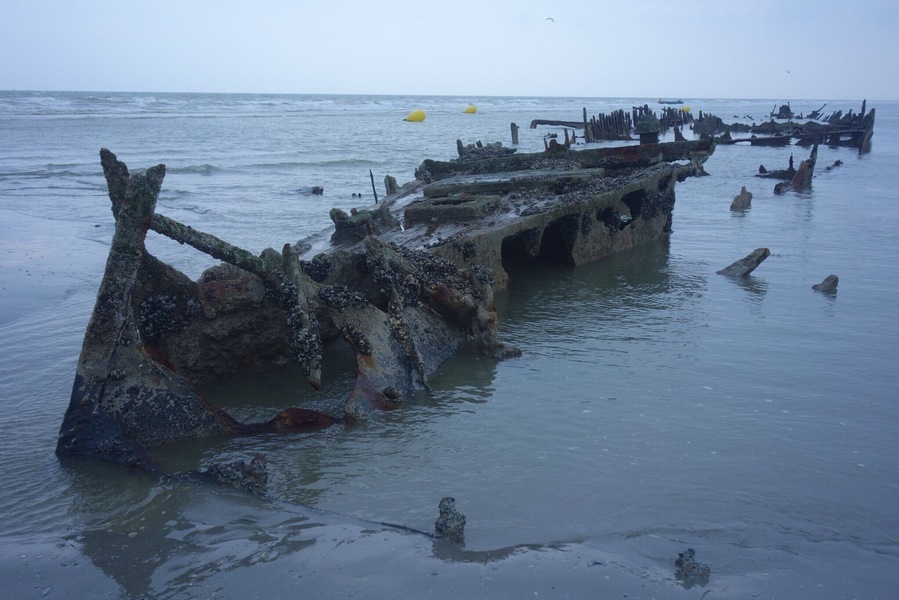Remains of the British steamer “HMS Devonia” on the beach of Zuydcoote (near Dunkirk), a reminder of the WWII Dunkirk evacuation in 1940. The Devonia came under air attack and after an explosion caused serious leaks astern, the commanding officer was instructed to beach the vessel as far inshore as possible in the hope that she could be used as a jetty and boarding point by the troops.
The shipwrecks on the beach of Zuydcoote can only be seen at spring tides. This shot was taken during low tide on April 1st, 2018 #BeachTips! #BVSBlue #LocalSecrets #History