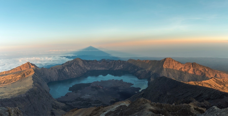 Hiking up Rinjani was hands down the hardest hike of my life! The early 2am climb up to the summit for sunrise was gruelling; however, the view from the top was an emotional one.  Standing on the top of the tallest Volcano in Lombok and having friends to share the experience is something I'll never forget! Where else in the world can you find a shadow of the volcano you're standing on appear to be the next tallest volcano around?