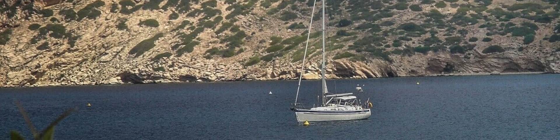 Anchored in the bay of Isla Cabrera, below a castle. This is a Spanish national park near Mallorca in the Balearic Islands.