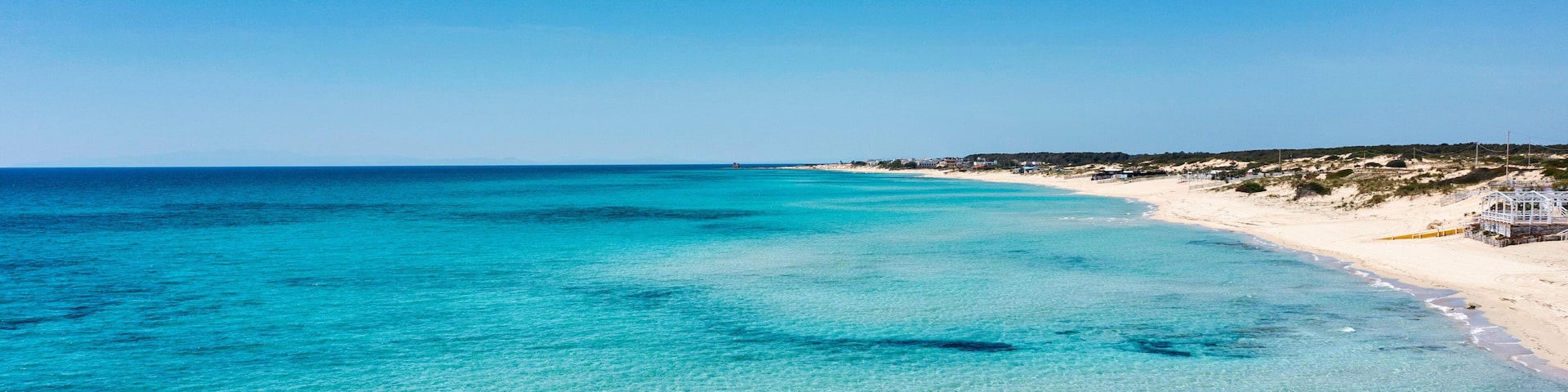 Sea and beach aerial view. A beautiful beach with white sand and crystal clear water - Salento, Apulia, Taranto, Italy