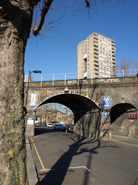 Railway bridge, Silchester Road, W10, carrying the Circle and Hammersmith & City lines between Latimer Road and Ladbroke Grove stations. Rearing above the parapet is the 20-storey Whitstable House, built in 1966.