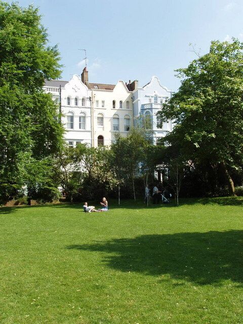 Lansdowne and Elgin Crescent Gardens Communal garden with local adults relaxing and children playing. Participating in Open Squares Weekend when this photo was taken.