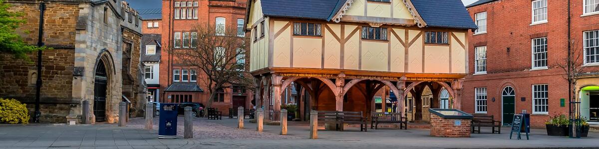 A panorama view across the old church square in Market Harborough, UK on a spring evening