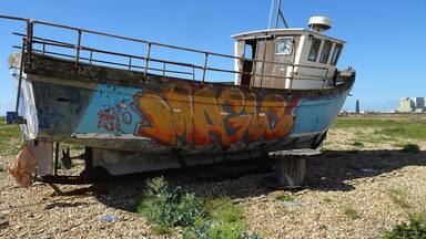 A particular landscape: a huge pebble beach, debris, abandoned and rusted material, in the distance the threatening shape of a huge nuclear power plant, some lonesome wrecks… #LocalSecrets
