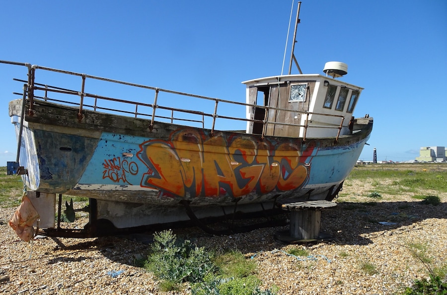 A particular landscape: a huge pebble beach, debris, abandoned and rusted material, in the distance the threatening shape of a huge nuclear power plant, some lonesome wrecks… #LocalSecrets