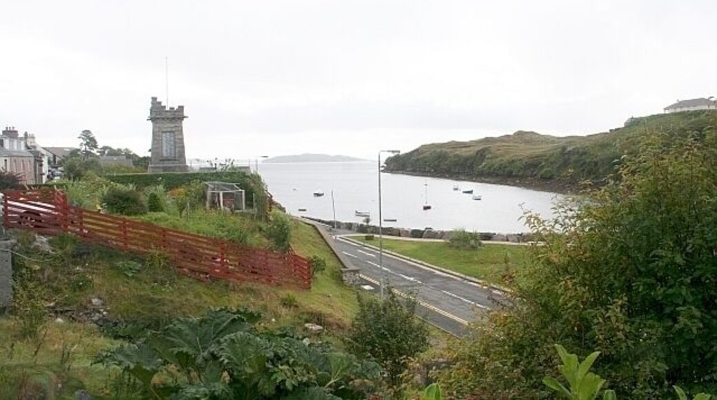 Tarbert War Memorial and the Harbour. The castellated monument overlooks the harbour. Other views: 562254 562265 and the names of the fallen: 562270 562275 562281 562287 562292