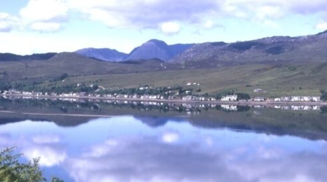 Lochcarron. The village of Lochcarron reflected in the calm waters of Loch Carron.