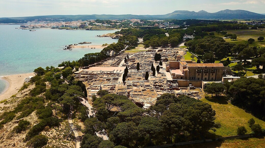 aerial view of the Museu Arqueològic d'Empúries, archaeology site at the beach of the Mediterranean Sea, l'Escala in the background, Girona, Catalonia, Costa Brava, Spain