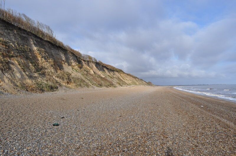 Cliffs at Dunwich, near to Dunwich, Suffolk, Great Britain. The shingle beach at famous Dunwich, the very edge of the All Saints churchyard is on top of the cliffs now, two graves can still be found (August 2009). <a href="https://www.geograph.org.uk/photo/67125">TM4770 : Buttress of All Saints church, Dunwich</a>