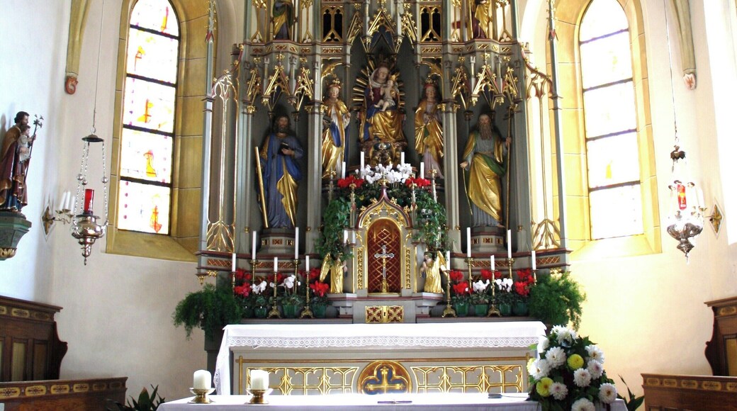 Italy, South Tirol, Natz-Schabs, Schlossergasse, Pfarrkirche Hll. Aposteln Philippus und Jakobus. The first mention of the parish church in Natz dates back to 1157 but the church was consecrated in 1208 by the prince-bishop Konrad von Rodank in honour of Saint Philip and Saint Walpurga. The present church was completed in 1484 in Late Gothic and consecrated once again to the Saints Apostles Philip and James. The bell tower was built in 1400 with granite blocks; in 1635 was damaged by fire and in 1686 was covered with a dome in Baroque style. The high altar is work by Peter Lapper of Natz made in 1855. In the throne of the high altar are the statue of the Madonna, Saint Agnes and Saint Ursula which are Gothc works of 1499 attributed to Michael Parcher; the statues of St. Philip and St. James are by F. X. Renn of Imst made in 1857. The painting of the right lateral altar represent the Baptism of Jesus and the left side altar correspond to the Holy Family, both works are by Michael Lackner of Bruneck. The first organ was installed on May 1st, 1909; the present one has been built by Orgelbau Pirchner of Steinach am Brenner and has 16 registers and 1250 pipes and was inaugurated on May 1st, 1990.