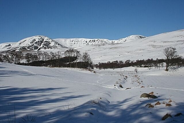 Looking towards Inchdowrie Only the foreground here is in square. Inchdowrie is at the far side of the glen. The hill on the left is Ben Reid (796 metres) and Loch Brandy is hidden in the corrie beneath the cliffs to its right. The highest point is Green Hill (870 metres).