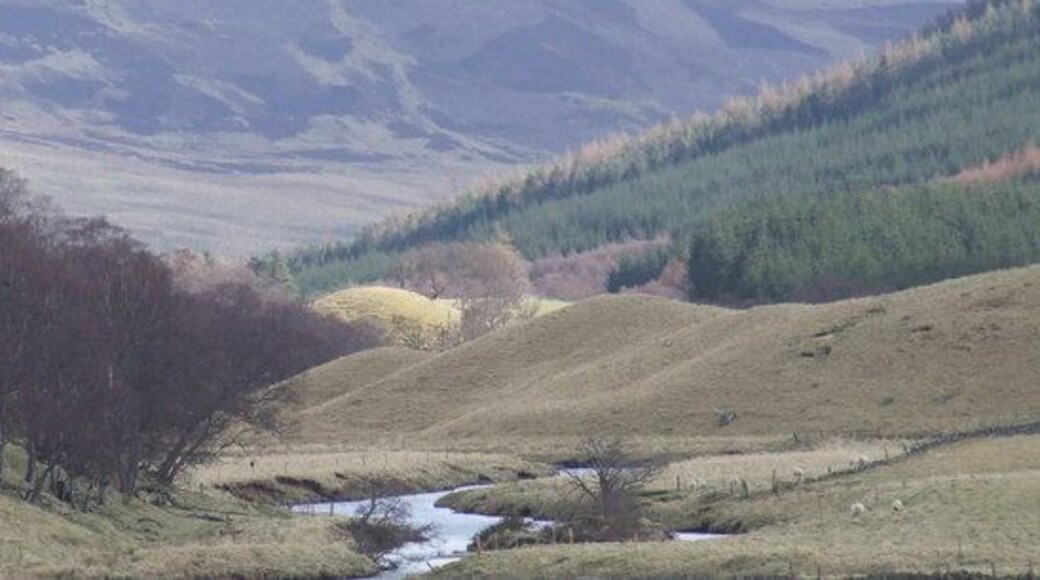 The South Esk amongst moraine The flat bottom of the U-shaped valley of Glen Clova is at several point almost choked by moraine. At this point the river winds its way amongst large moraine composed of deposits of sand and boulders. This area probably marks one of the most recent areas of glacial activity during the Lochlomond stadial period.