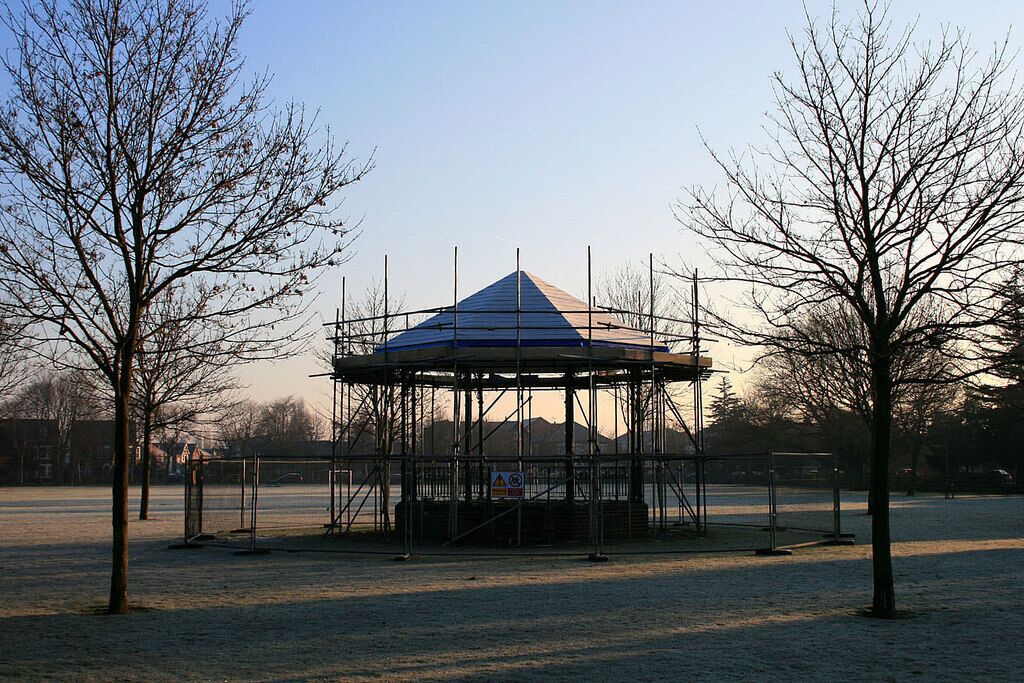 Beeston Bandstand Undergoing remedial work. The common octagonal-shaped bandstand is here surrounded by a circle of twelve trees.