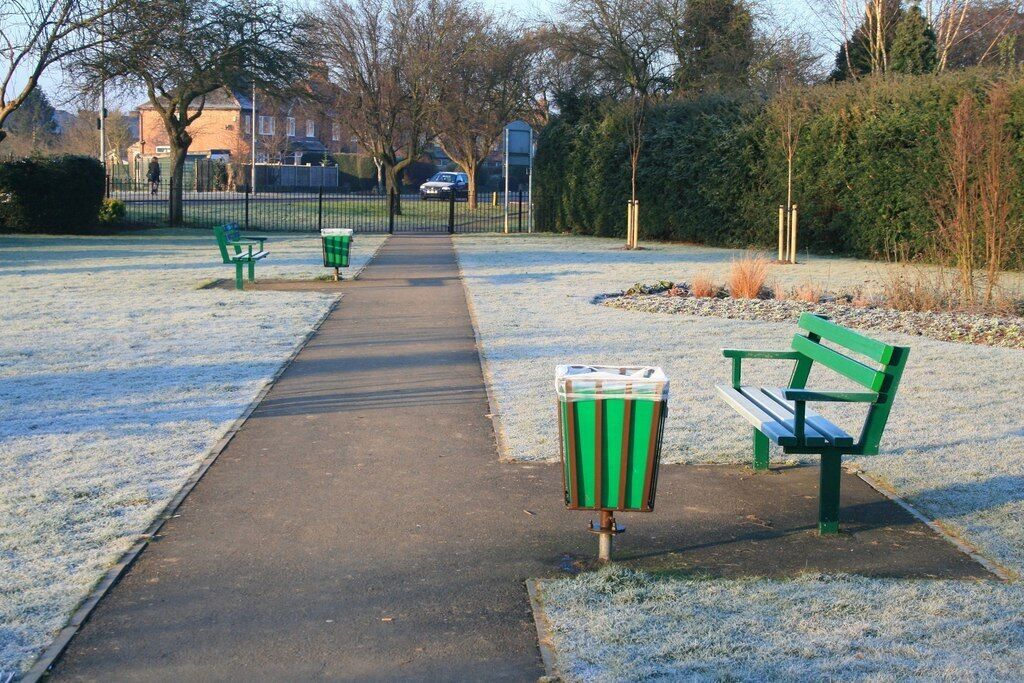 Benches on a frosty morning Looking toward the western exit from the Dovecote Lane Recreation Ground. The houses in the background are on Queens Road West.