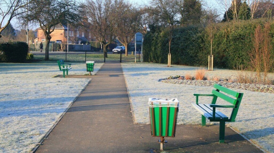 Benches on a frosty morning Looking toward the western exit from the Dovecote Lane Recreation Ground. The houses in the background are on Queens Road West.