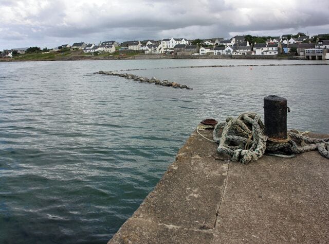 The breakwater, Bowmore harbour The distant buildings face onto Shore Street.