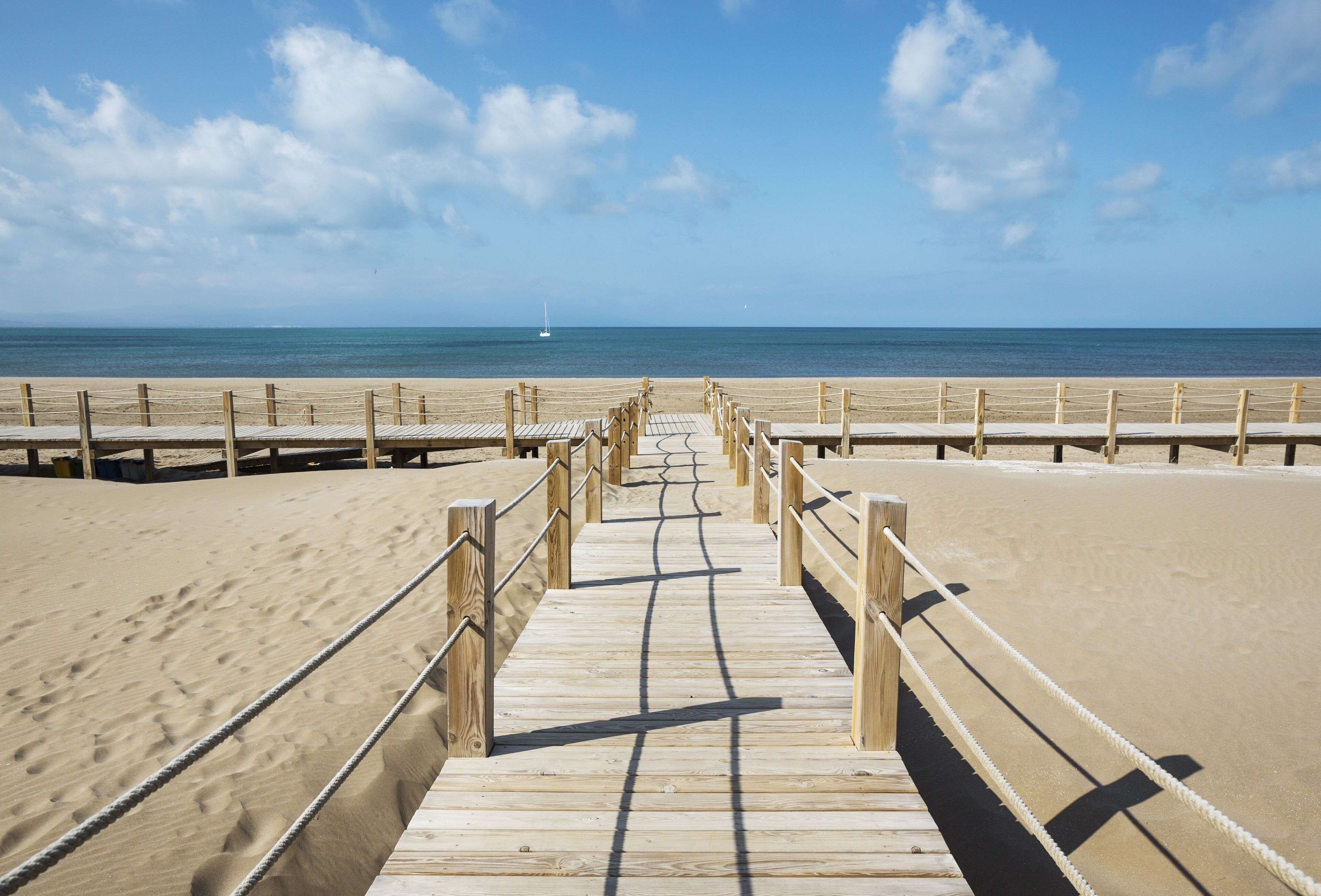 Wooden footbridges at the beach of Riumar, Ebro Delta Nature Reserve, Tarragona province, Catalonia, Spain, Europe