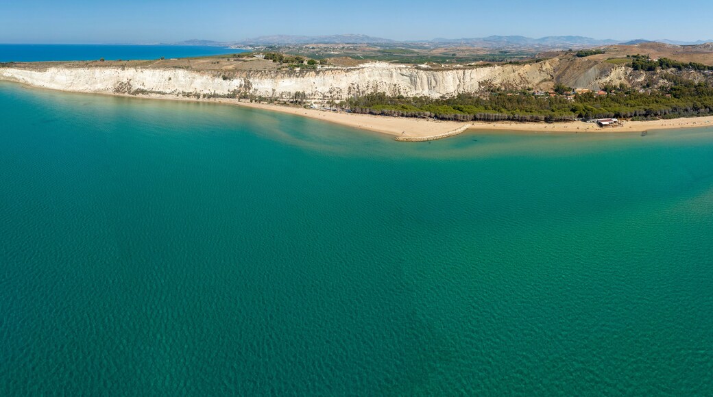 Panoramic aerial view of Eraclea Minoa beach, located in province of Agrigento, Sicily, Italy. It's characterized by a high white cliff. It's a beautiful sunny day. The Mediterranean sea in foreground