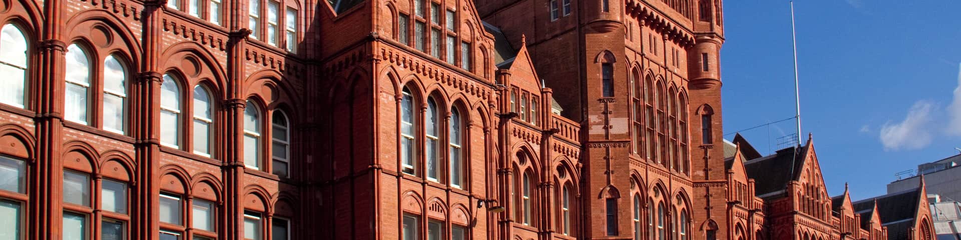 Gothic Revival style office block. Built 1885-1901 in several phases, by Alfred Waterhouse assisted by his son Paul.