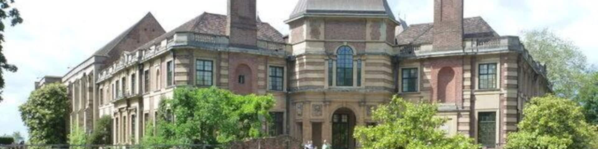 Eltham: Eltham Palace. Completed in 1936, this grand mansion stands in beautiful gardens which make a feature of the moat. The palace was built adjoining the Great Hall of the original Eltham Palace, built in the 1470s - it is the part mainly hidden in this picture by the foliage far left.