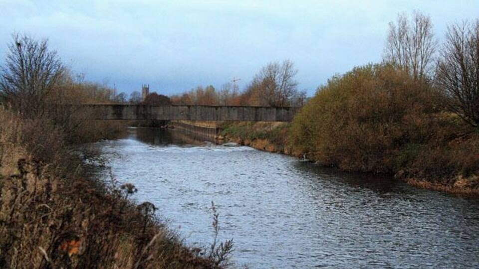 A Pipe Bridge Over the Derwent With the tower of Derby Cathedral in the distance.