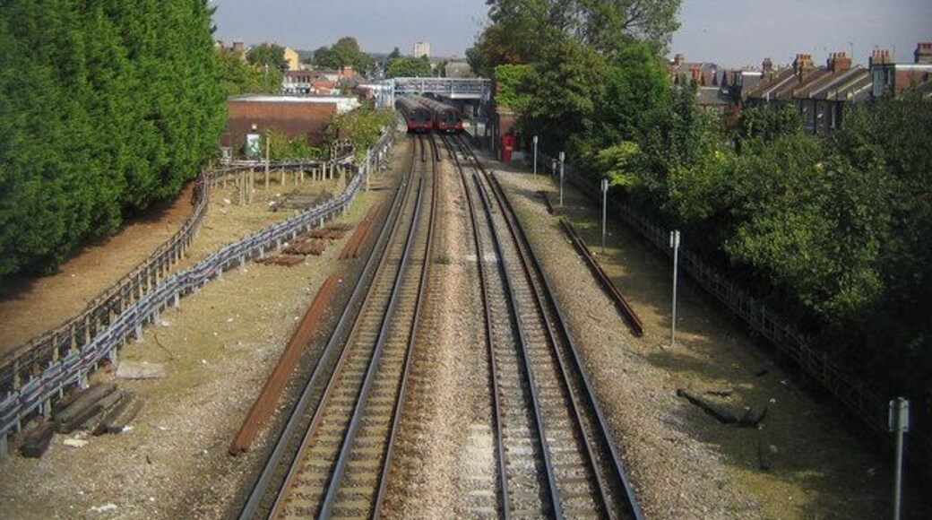 Central Line railway in South Woodford Northbound and southbound trains stopped in South Woodford station are visible in this view from the footbridge between Marlborough and Pulteney Roads.