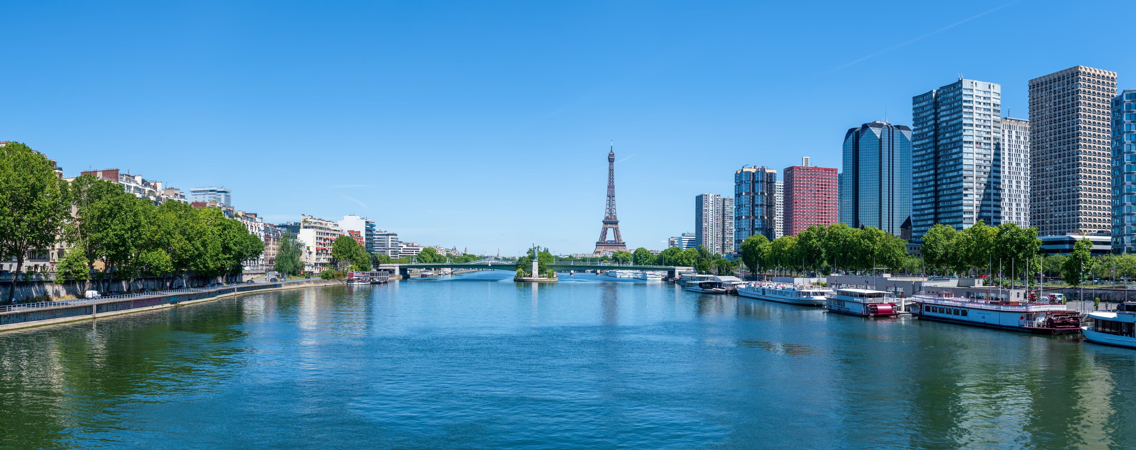 Panoramic of Eiffel Tower, Seine river and Statue of Liberty in Paris, France.