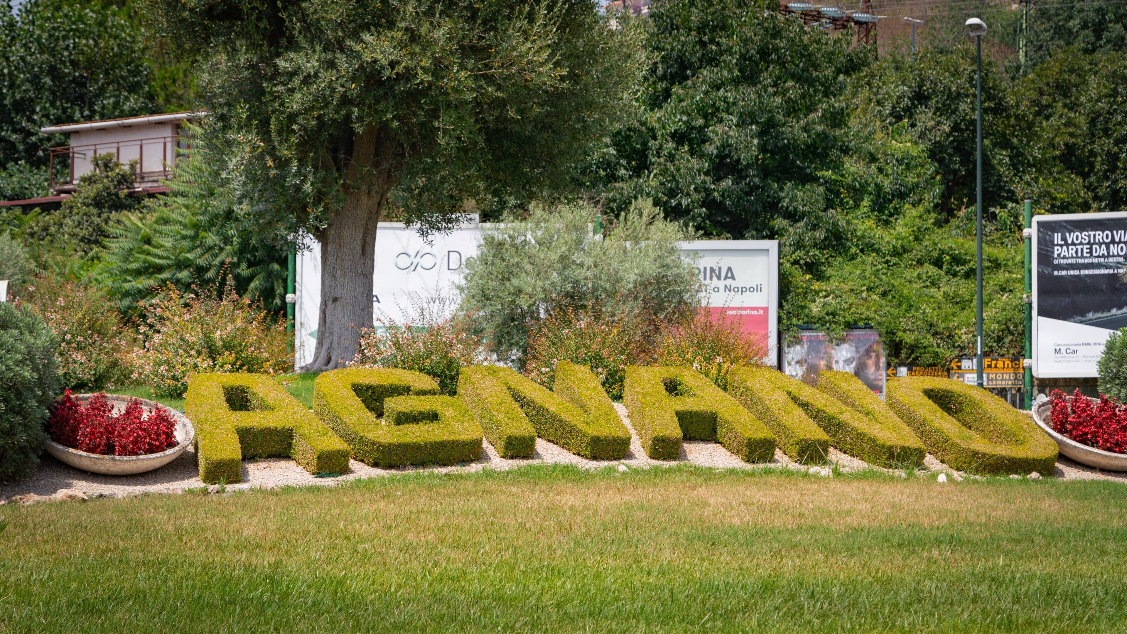 Agnano which includes outdoor art, a park and signage