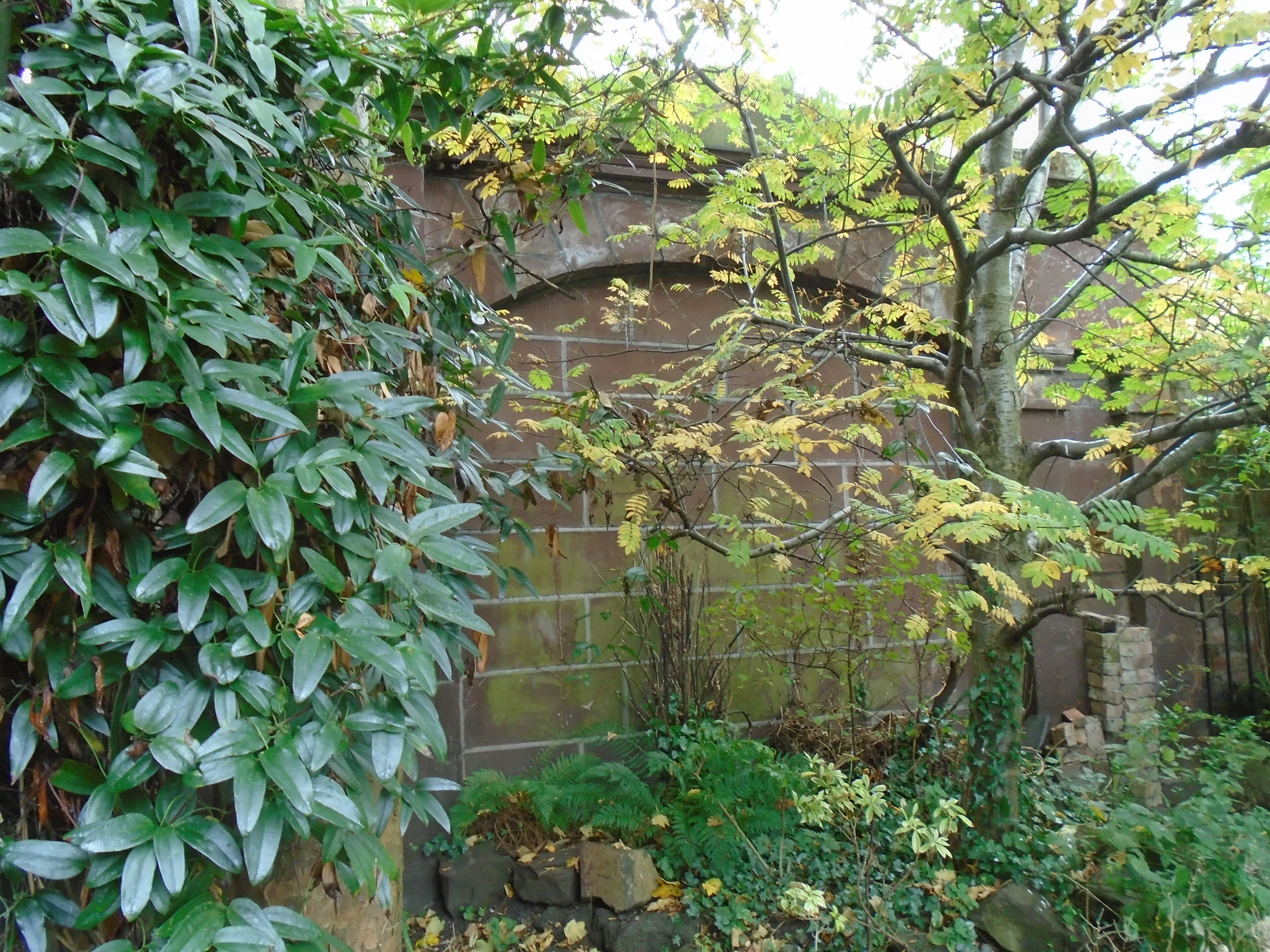 Somewhat obscured by foliage at this time of year and behind a wall of wheelie bins (cuh!), this gateway was built in the 1840s and is Grade II listed.
