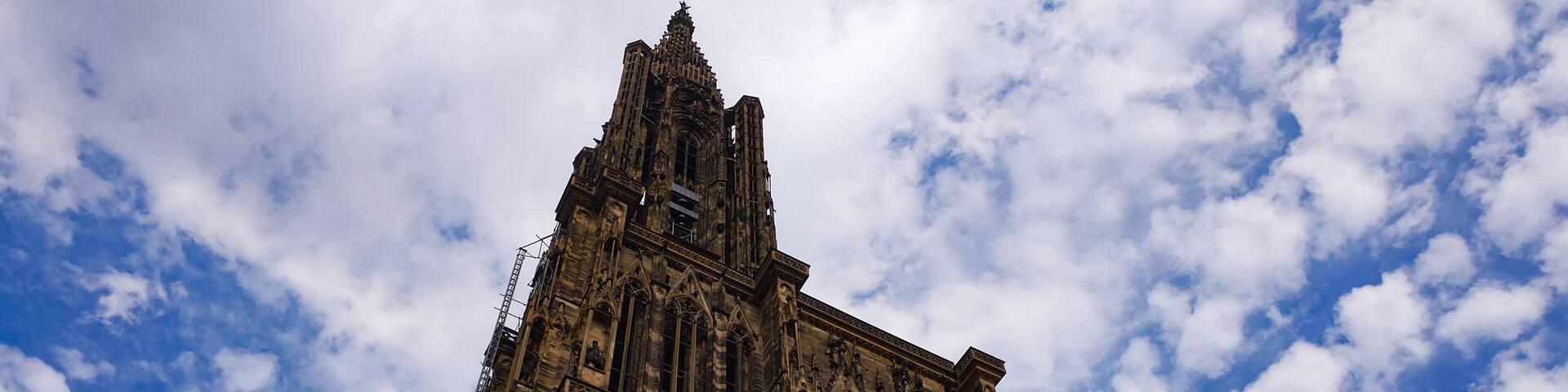 A Gothic cathedral with intricate stonework and a large circular window.
