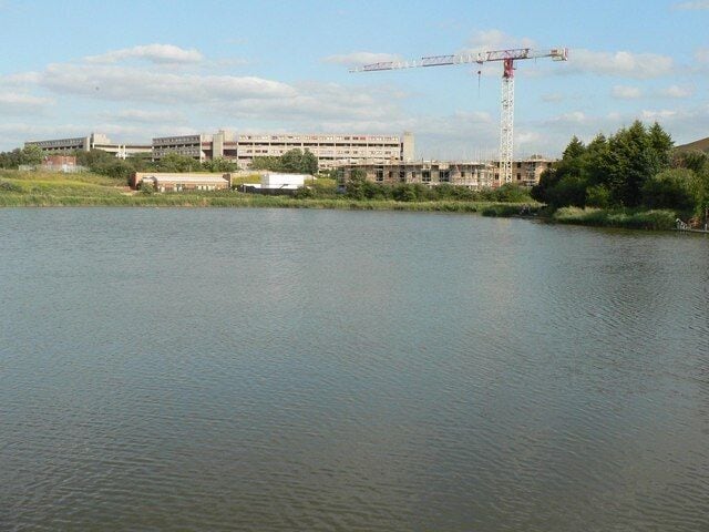 Thamesmead: view across the lake Looking across the lake behind the leisure centre, with the residential blocks in the distance.