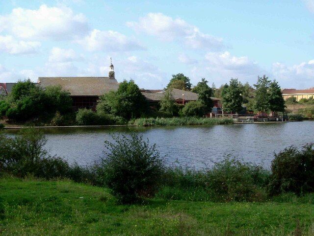 Thamesmere. Looking across Thamesmere Lake towards the Thamesmere Leisure Centre. Rather prosaically the Environment Agency pumping station on the lake refers to the location as "Lake 4".