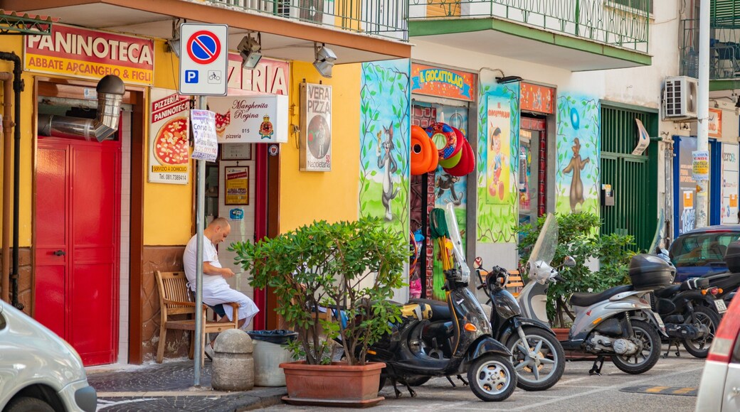 Secondigliano featuring street scenes as well as an individual male