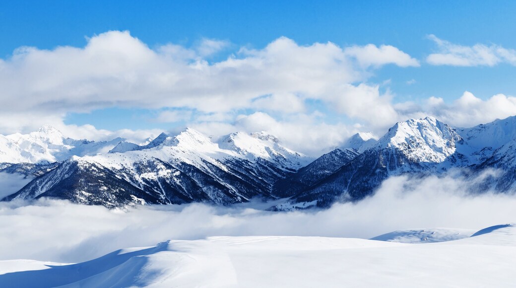 Panoramic view of mountains near Brianson, Serre Chevalier resort, France. Ski resort landscape on clear sunny day. Mountain ski resort. Snow slope. Snowy mountains. Winter vacation. Panorama, banner.