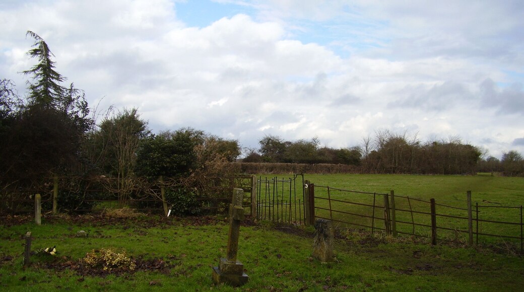 Kissing behind the church A kissing gate and clearly defined footpath at the rear of St John's church.