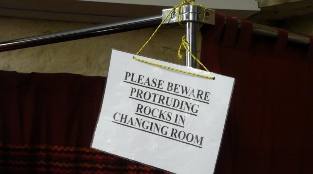 Just outside the city of Wells is a place called Wookey Hole, where you can go and visit underground caves. The whole area is very rocky with a gorge (Cheddar) nearby which is amazing. There's a small village, with shops built up against the cliffs, and in a shop selling clothing I saw this. Not a problem you get in many changing rooms!