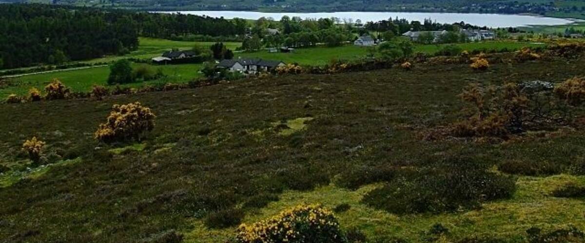 Looking over Bonar towards the Kyle of Sutherland Looking over the top part of Bonar Village, the Bonar School being the big building to the right of the photo, then over the Kyle of Sutherland towards the hills beyond.