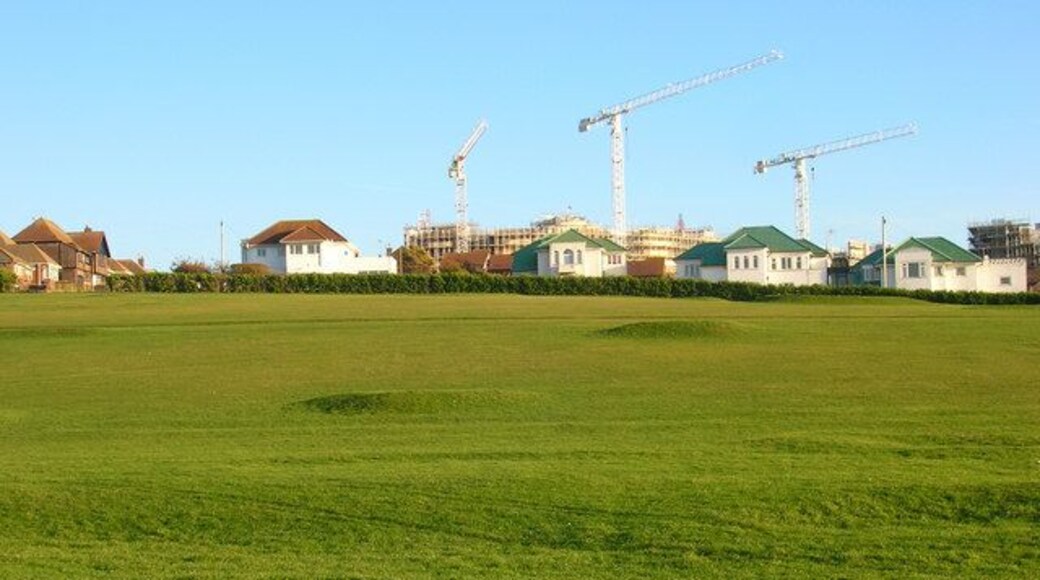 Saltdean Pitch and Putt On the eastern slope of Saltdean Park. The houses behind are in Arundel Drive East whilst the cranes are currently on the building site of the former Ocean Hotel.
