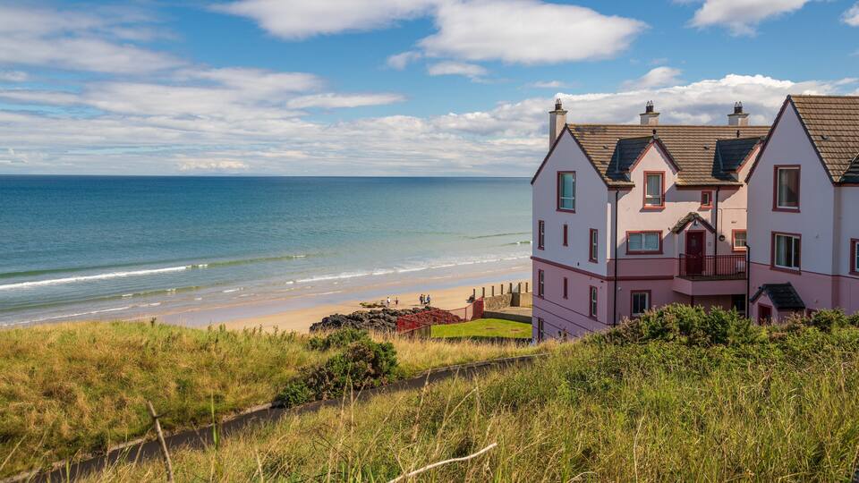 A coastal house with a beach view.