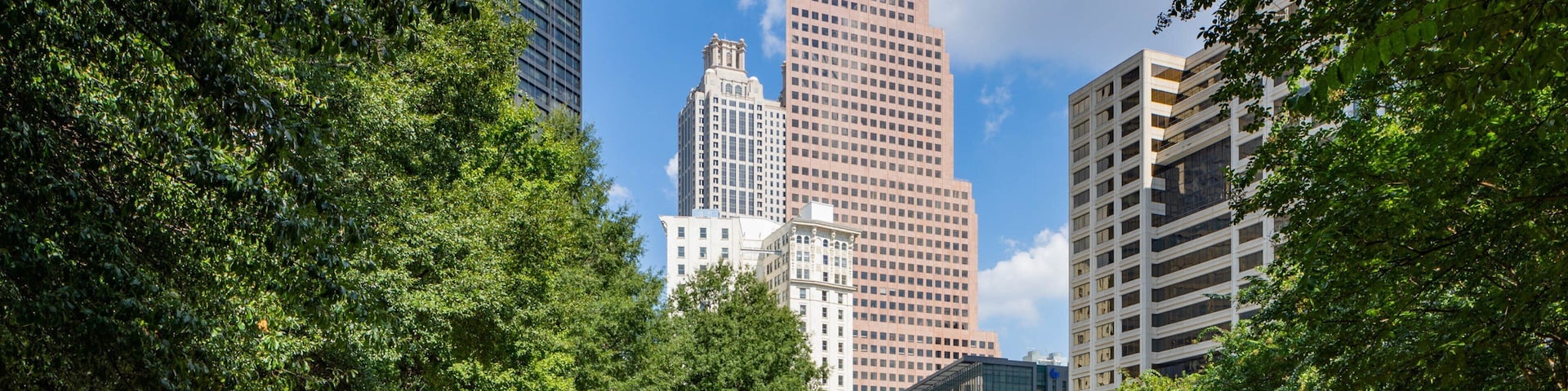 Woodruff Park which includes a high rise building, a park and a city