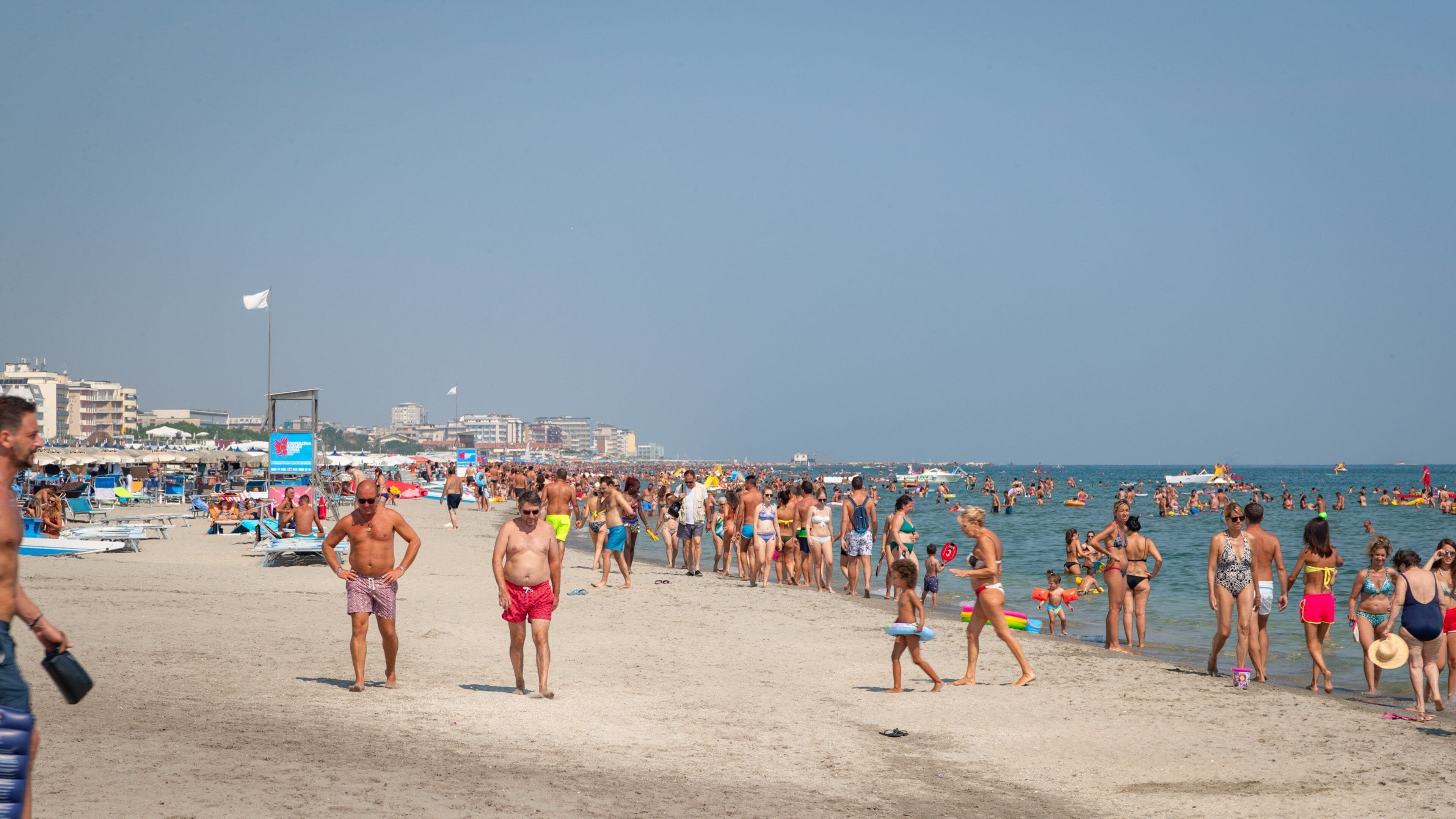 Papeete Beach which includes general coastal views, swimming and a sandy beach