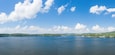 The panoramic view of Lac des Settons in the middle of forests in Europe, France, Burgundy, Nievre, Morvan, in summer, on a sunny day.