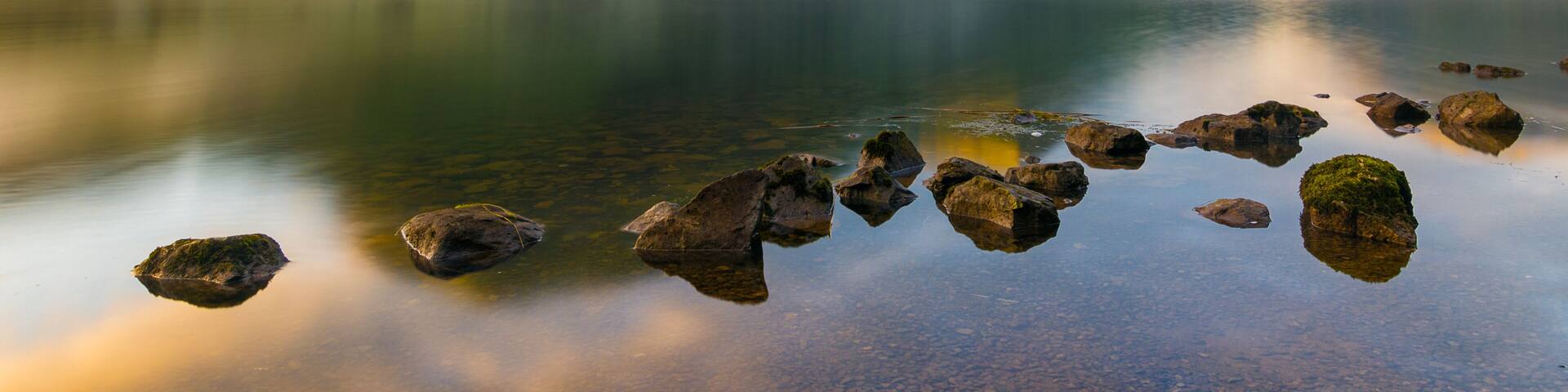 Morning sunlight hitting mountains at Brotherswater in the English Lake District.