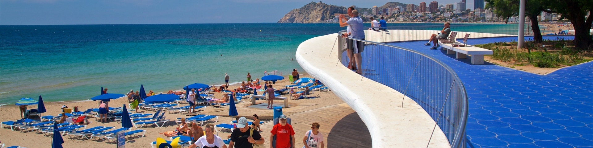 Benidorm Centro featuring a beach and general coastal views as well as a small group of people