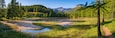 Lac de Roue lake in the Queyras Nature Park late Spring -early Summer (panoramic). Hiking site near Arvieux in the Hautes-Alpes, French Alps, France
