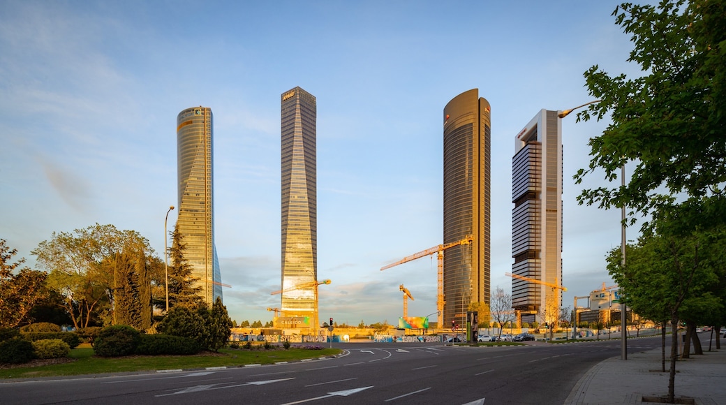 Four Towers Business Area featuring a skyscraper, a park and a sunset