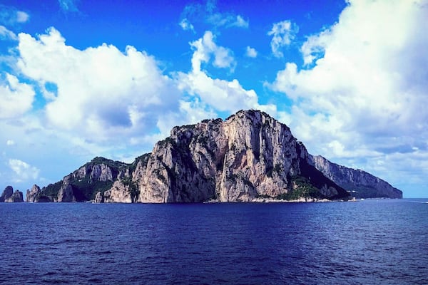 Capri is an island located in the Tyrrhenian Sea off the Sorrentine Peninsula, on the south side of the Gulf of Naples in the Campania region of Italy. The main town Capri that is located on the island shares the name. It has been a resort since the time of the Roman Republic.