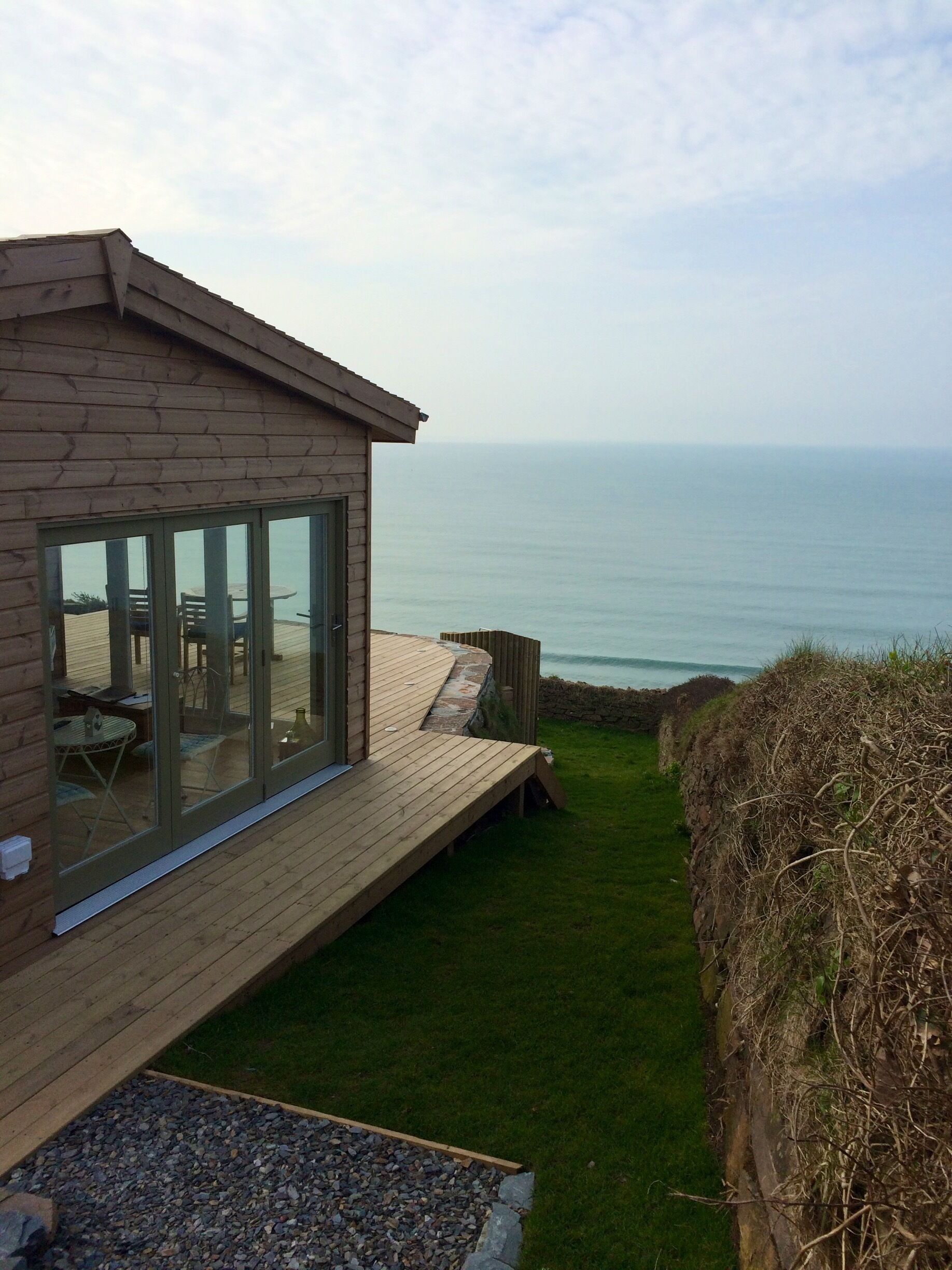 Rent this Cute clifftop Ecocabin from Unique Homestays. It's called Seaglass and its a treat. Perched above the beach with wonderful sunsets! Bliss.
