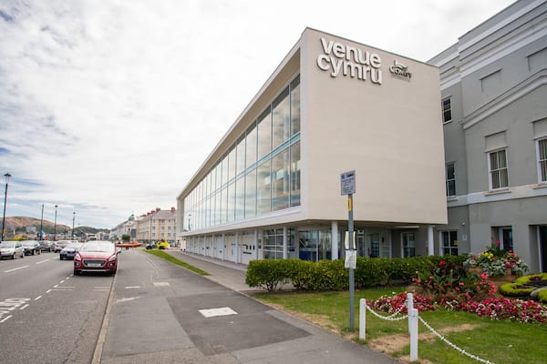Venue Cymru featuring flowers, a park and signage